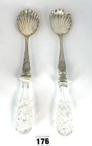 2 silver and glass serving spoons