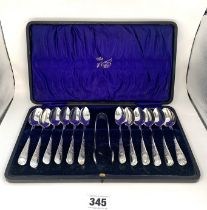 12 silver teaspoons and tongs