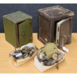 Two miniature painted steel safes, (only one with key), largest 7" wide, 7" deep and 9" high;