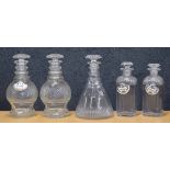 Pair of Georgian cut glass decanters with stoppers, 9.5" high; together with a pair of smaller