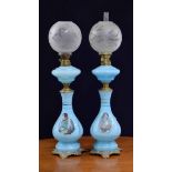 Pair of 19th century opaline blue glass oil lamps, decorated with the portraits of Napoleon and