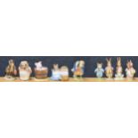 Nine Beatrix Potter figures; including Beswick F. Warne and Co. and Studio of Royal Doulton; Mrs