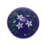 Saint-Louis limited edition glass paperweight, with three white flowers on a blue ground, no. 13/
