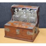 Early 20th century walnut tantalus humidor with silver plated mounts, the raised mirror back