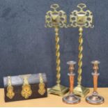 Tall pair of brass andirons, raised on twist supports over square bases, with impressed registration