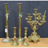 Pair of tall Victorian brass pusher candlesticks on circular bases, 18" high; together with a pair