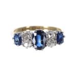 Attractive 18ct and platinum sapphire and diamond ring, with three oval sapphires and four old-cut