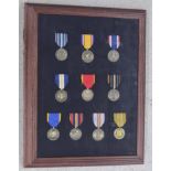 Framed selection of ten American Armed Forces commemorative medals