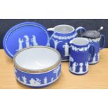 Five pieces of Wedgwood blue Jasperware, including a silver plate mounted fruit bowl, bulbous jug,