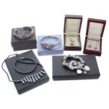 Silver (925) gem set bangle, boxed; together with a further silver (925) bangle (boxed);
