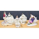 Two Dresden lace porcelain figural groups of courting couples, largest 9" wide, 7" high; together