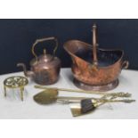 Collection of Victorian fireside tools including copper coal helmet, copper kettle, brass trivet,