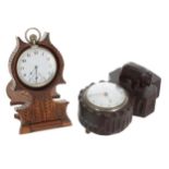 Black forest carved desk timepiece, mounted with a bear and with letter slot, the movement signed