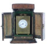 French brass miniature carriage clock timepiece, stamped with the maker's trademark logo beneath the