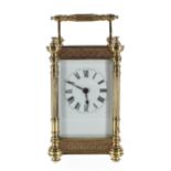 Carriage clock timepiece, within a fancy filigree banded and pillared case, 6.25" high (key)