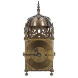 English brass single fusee lantern clock, the 6" brass dial enclosing a foliate engraved centre,