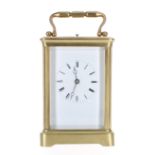 French repeater carriage clock striking on a gong, within a corniche brass case, 7" high (key)