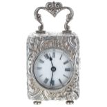 French white metal miniature carriage clock timepiece, the 1.75" white dial within a case repoussé