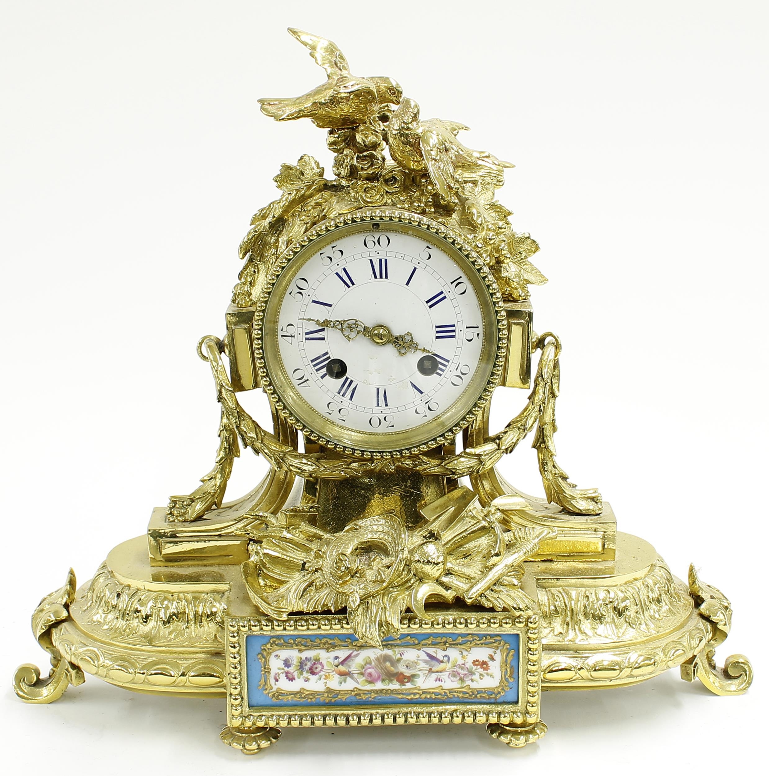 French style gilt metal and porcelain mounted two train mantel clock, the movement with outside