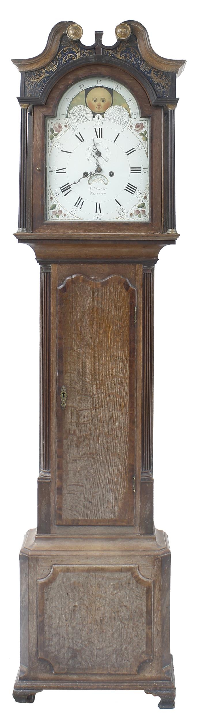 Oak and mahogany crossbanded eight day longcase clock, the 13" painted arched dial signed JNO