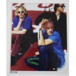 REM - autographed coloured promotional photograph, glazed and framed, 13" x 11" *Sold with a