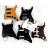 Five Strat type pickguards, all loaded with miscellaneous electronics; together with a three-ply