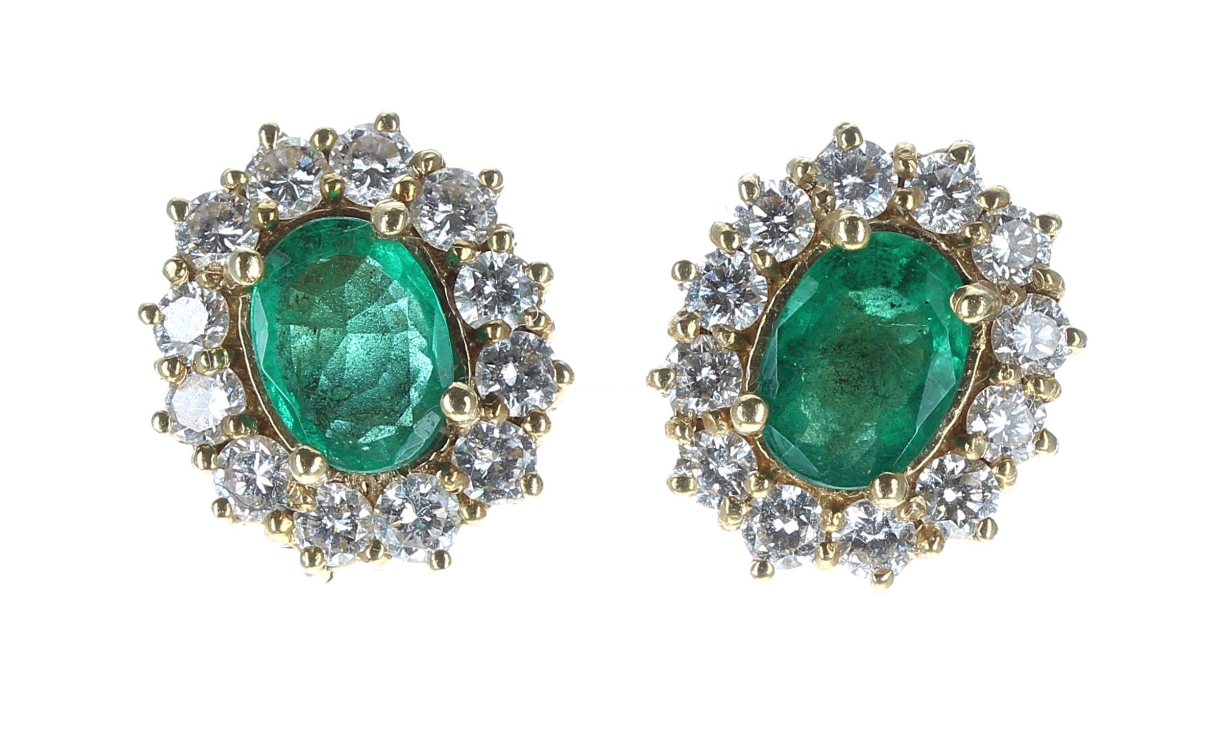 Pair of 18ct yellow gold oval emerald and diamond cluster earrings, the emeralds 1.10ct approx in