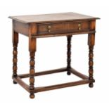 18th century oak side table, the moulded top over a single drawer, raised on turned legs united by