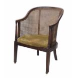 19th century bergere tub chair, the back and sides with cane panels raised on square legs