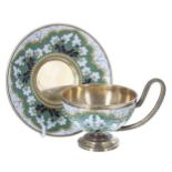 Russian silver gilt and cloisonné tea cup and saucer, decorated with stylised white flowers on a