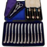 Set of twelve George V silver pistol grip handle butter knives, maker Harrison Brothers & Howson,