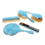 Attractive George V silver and blue guilloché enamel five piece dressing table brush and hand mirror
