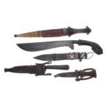 Selection of five sorted Persian daggers / knives, to include a machete type with shaped 12.5" blade