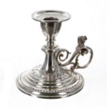 Ornate French silver chamber stick, with a knopped stem and scrolling handle cast with the bust of a