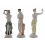Two similar Capodimonte porcelain figures of ladies, semi-draped, upon stepped circular plinths,