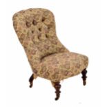 Victorian button upholstered nursing chair on turned front legs terminating on brass casters, 22"