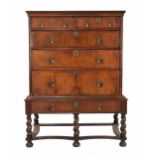 William and Mary walnut veneered chest on stand, the chest of two short over three long graduated