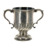 George III silver twin-handled pedestal cup, with leaf capped C scroll handles and half gadrooned