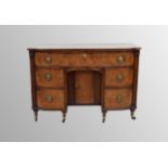 19th century mahogany kneehole bowed dressing table, the large frieze drawer over a central recessed