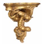 European carved giltwood wall bracket, possibly 18th century, the shaped lobed and moulded top