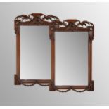 Pair of Continental oak classical wall mirrors, possibly 18th century, with rectangular plates