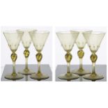 Set of six Venetian amber wine glasses, the octagonal bowls over twist knopped stems, with gold