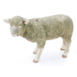 Weathered moulded resin sculpture of a standing lamb, 17" high