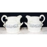 Pair of large antique style relief moulded water jugs, with two handles and acanthus leaf decoration