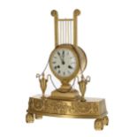 French Empire ormolu two train mantel clock with silk suspension striking on a bell, 3" circular