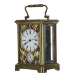 French brass alarm carriage clock striking on a bell, the 2" diameter enamel dial within a foliate