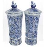 Pair of early Delft faience glazed octagonal fluted pottery vases with covers, possibly Rouen