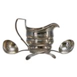 Georgian silver oval cream jug, of lobed helmet form with engraved foliate borders, the makers