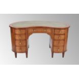 Attractive Edwardian mahogany, satinwood and floral marquetry kidney-shaped desk, with an inset gilt