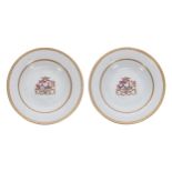 Pair of Chinese export armorial porcelain circular shallow bowls, each painted with coat-of-arms